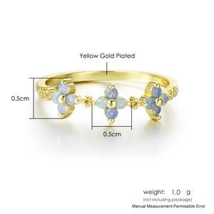 Gold plated ring for women featuring three light blue opal flower stones with thin band