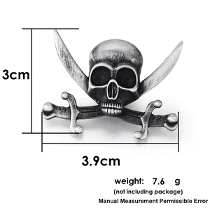 Detailed size view of a retro gothic skull and crossbones metal biker pin