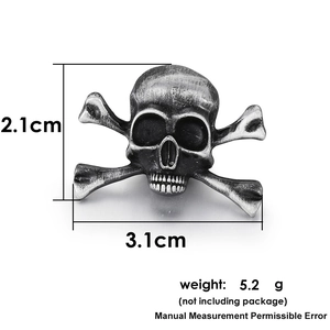 Macro detail of gothic skull brooch with dimensions 2.1cm by 3.1cm and vintage finish