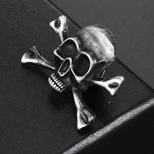 Macro view of vintage skull and crossbones brooch with antique silver finish detail