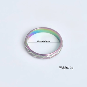 Rainbow gradient stainless steel ring with purple glitter inlay and wavy patterns