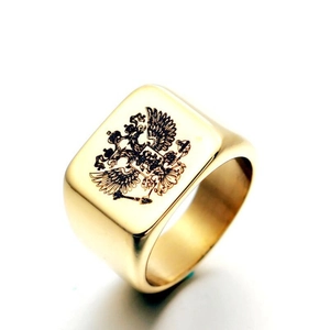 Detailed view of a gold-plated stainless steel signet ring with a double-headed eagle emblem