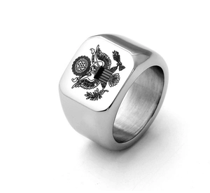 Detail macro of polished stainless steel signet ring with American Eagle crest engraving