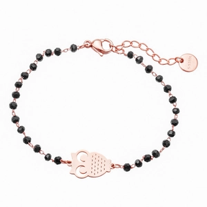 Detail of rose gold owl charm and black beaded bracelet with S-STEEL lobster clasp