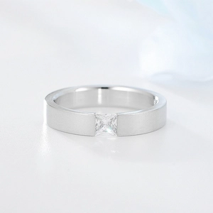 Macro detail of silver titanium steel ring with matte brushed finish and square zircon stone