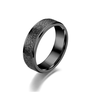 Minimalist black matte stainless steel ring with polished edges and industrial style