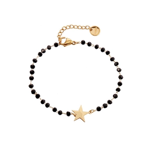 Macro shot of black faceted beads and gold star pendant on stainless steel bracelet