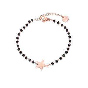 Detailed macro of rose gold titanium steel bracelet with black beads and star charm