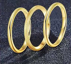 Three-piece stackable titanium steel rings featuring polished and frosted gold finishes