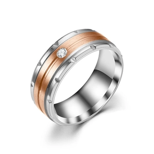 Two-tone titanium steel ring with rose gold brushed texture and centered zircon stone