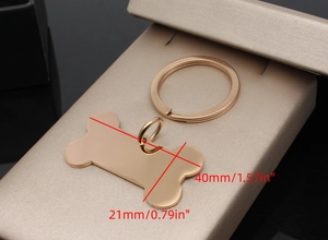 Macro shot of bone shaped rose gold stainless steel pet tag with size dimensions