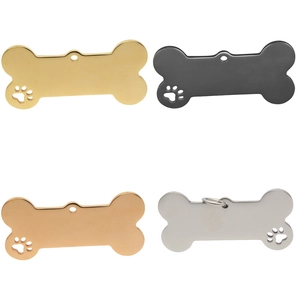 Polished bone-shaped stainless steel pet ID tags with paw cutouts in four colors
