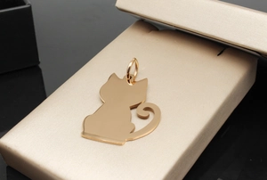 Detailed view of cat-shaped stainless steel pet ID tag in polished rose gold finish