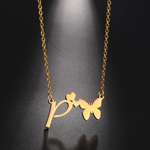 Golden stainless steel butterfly heart necklace with initial P pendant on a dark background