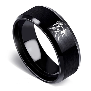 Close-up of black brushed stainless steel ring with Gemini sign and beveled edges