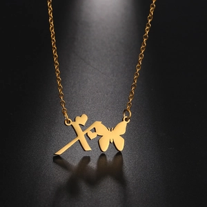 Detail of gold-plated butterfly heart necklace with polished stainless steel textures