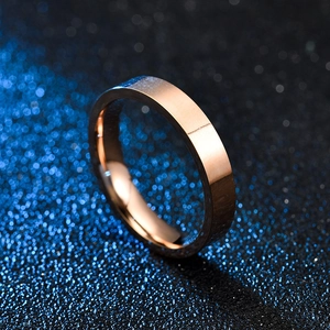 Detailed view of a 4mm rose gold stainless steel ring with flat mirror polished finish