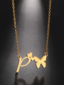 Close-up of golden stainless steel necklace with P letter, heart and butterfly pendant