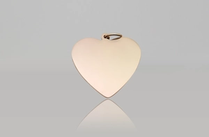 Close-up of heart-shaped rose gold pet ID tag with smooth mirror finish and ring