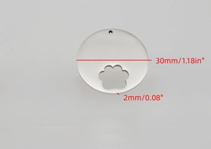 Detail view of 30mm stainless steel pet ID tag with a hollowed-out paw print design