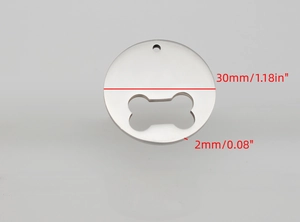 Macro detail of round stainless steel pet tag with bone cutout showing 30mm diameter size