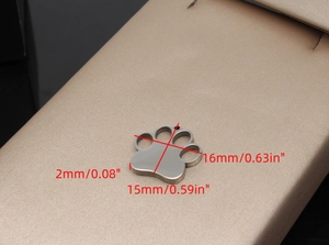 Detailed view of paw-shaped pet ID tag with exact dimensions and polished steel finish