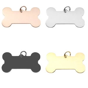 Bone-shaped stainless steel pet ID tags in gold, silver, black, and rose gold finishes