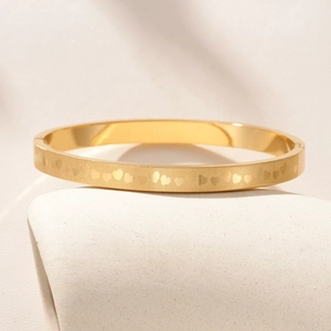 Titanium steel heart grid bangle with gold finish and classic hinge clasp closure