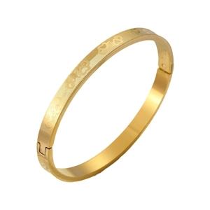 Gold titanium steel bangle featuring heart and grid texture with hidden clasp