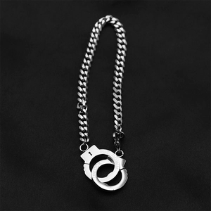 Silver stainless steel curb chain bracelet with interlocked unlock and put down handcuffs