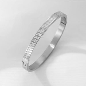 Titanium steel bangle with Greek key pattern and secure mechanical clasp for couples