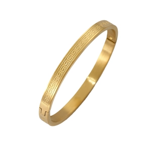Titanium steel bracelet with gold Greek key pattern and secure snap buckle closure