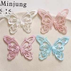 Elegant cutout acetate butterfly charms in pearlescent white, pink, purple and blue tones