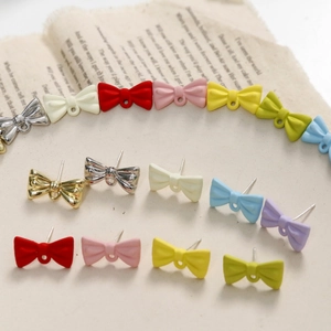 Colorful alloy bow earrings with rubber paint finish and butterfly design in various shades