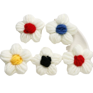 Handmade crochet milk cotton puff flowers in white with colorful centers for DIY crafts