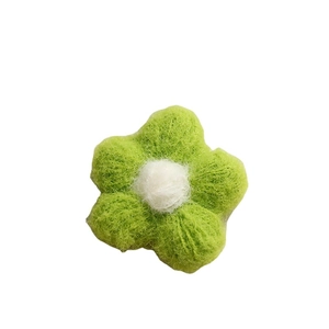 Handmade green and white plush crochet flower for DIY jewelry and accessories