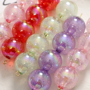 Perles en verre colorées avec bulles et tiges dorées pour création de bijoux