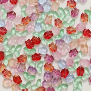 Colorful glass tulip flower and leaf beads for DIY jewelry making set on white backdrop