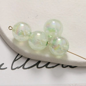 Macro de perles bulles irisées vert clair sur tige dorée pour la création de bijoux