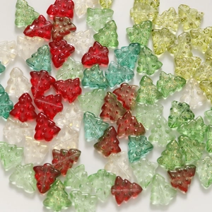 Macro shot of colorful glass Christmas tree beads with glitter for DIY jewelry making