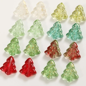 Macro view of crystal glass Christmas tree beads with glitter details for DIY jewelry