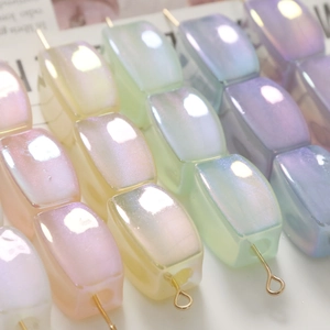 Macro view of geometric iridescent rectangular beads for DIY jewelry and hair accessories