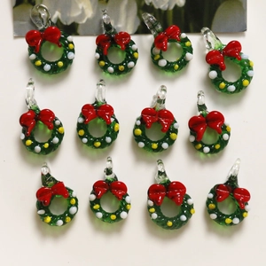 Set of 12 Christmas wreath charms with red bows and green glass finish for DIY crafts