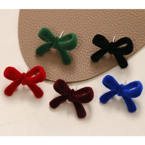 Flocked velvet bow earrings set in multiple colors including red, navy, and green