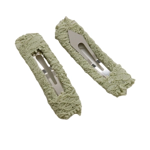 Set of two light green lace fabric BB hair clips with handmade crochet mesh texture