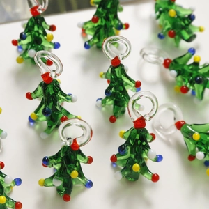 Macro detail of handmade colorful glass Christmas tree pendants with festive dotted texture