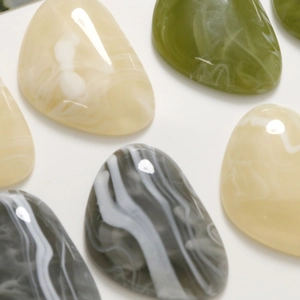 Polished resin triangle stone charms in marble and solid colors for DIY hair clips