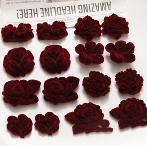 Detail of deep red velvet floral patches and rosebuds for DIY earring materials