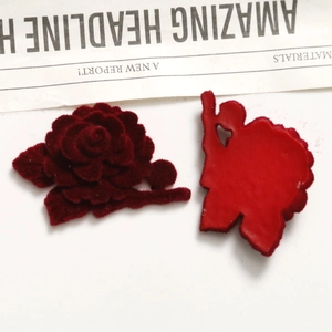 Macro shot of flocked burgundy velvet roses with heart-shaped cutout back for DIY crafts