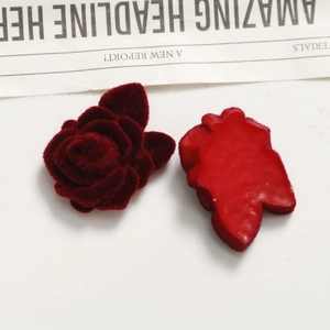 Macro detail of deep red velvet rose flower bud DIY craft accessory for jewelry